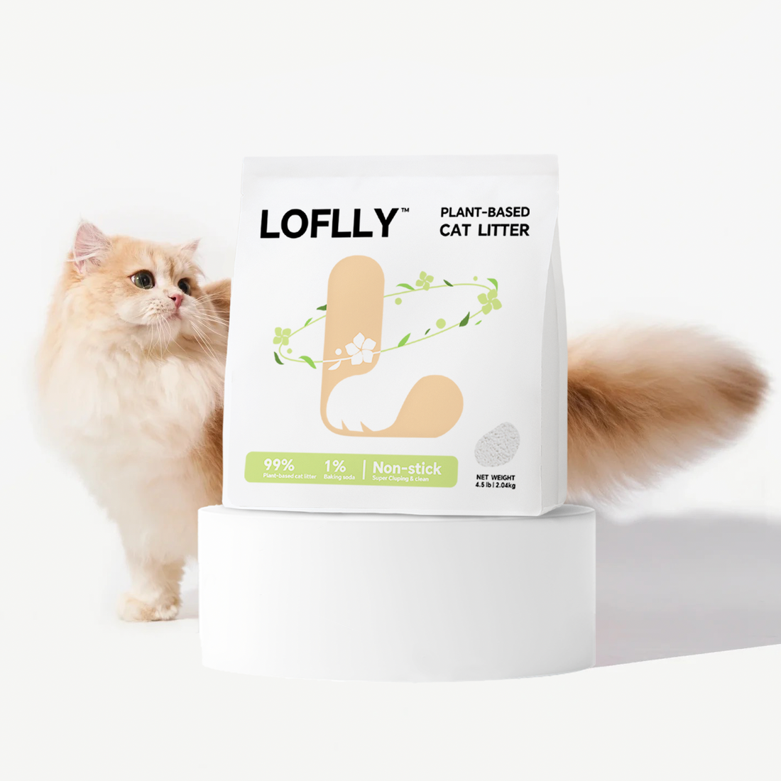 Fluffy long‑haired cat peeking behind a LOFLLY Plant‑Based Cat Litter bag displayed on a white pedestal in a bright, minimalist setting